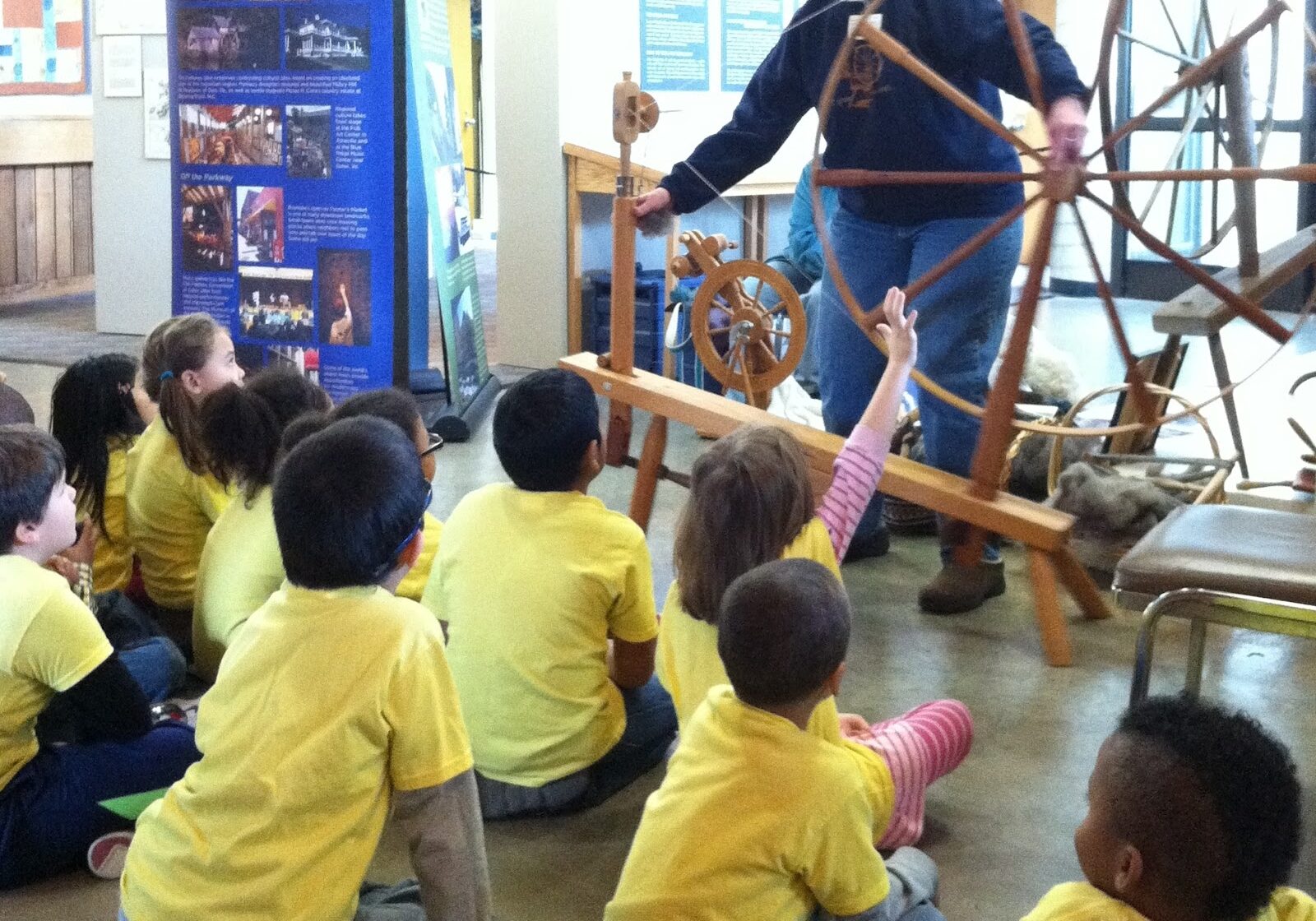 Mary Nichols showed the kids how she spins on a spinning wheel.
