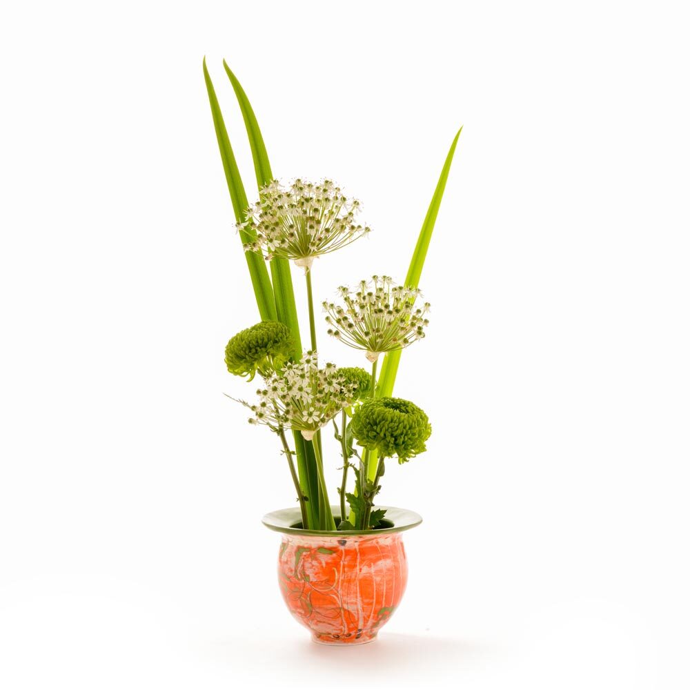orange green and white wheel thrown small low vase